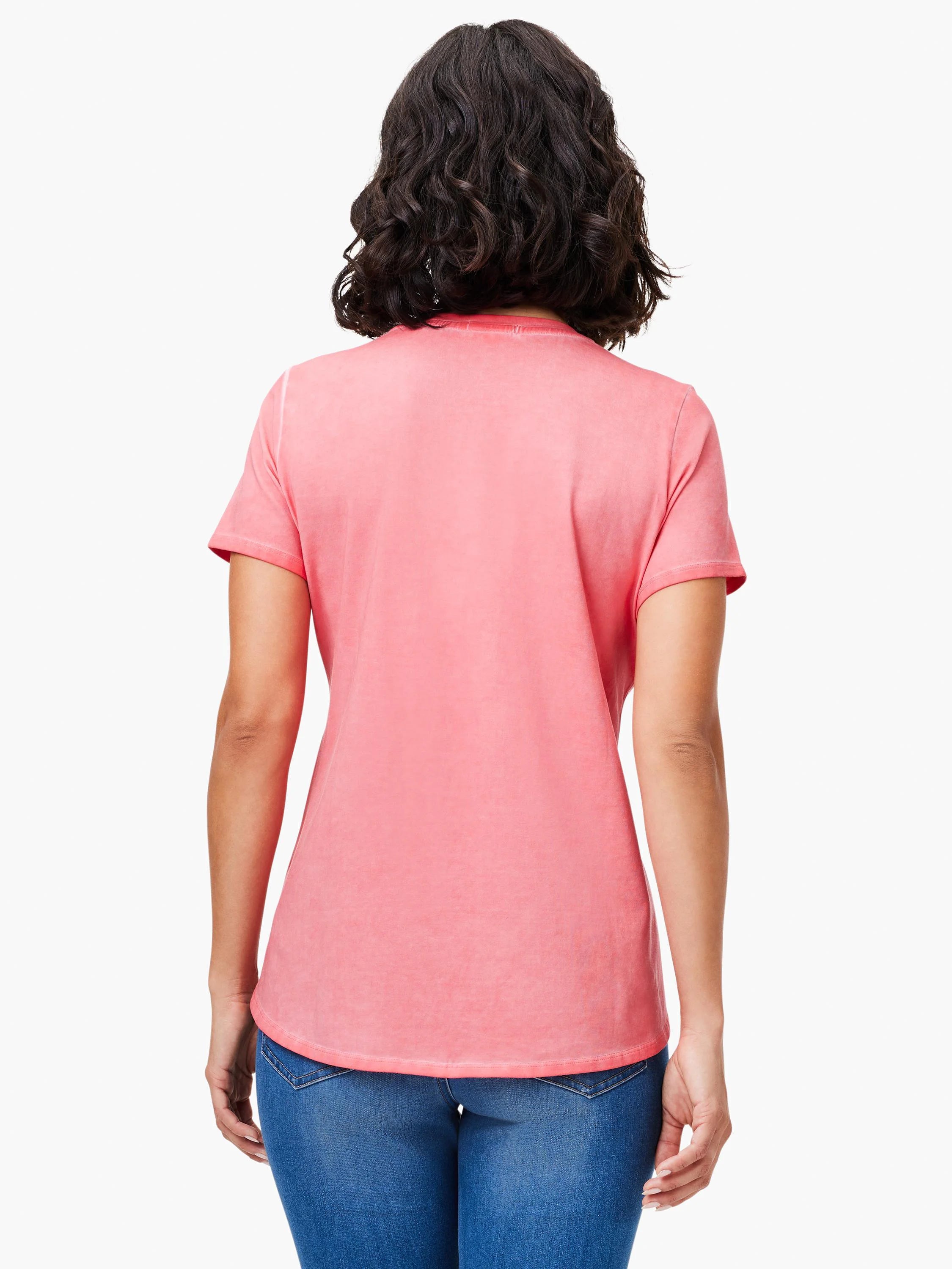 Faded coral short sleeve crew neck tee on a model's back, featuring a shirt tail hem.