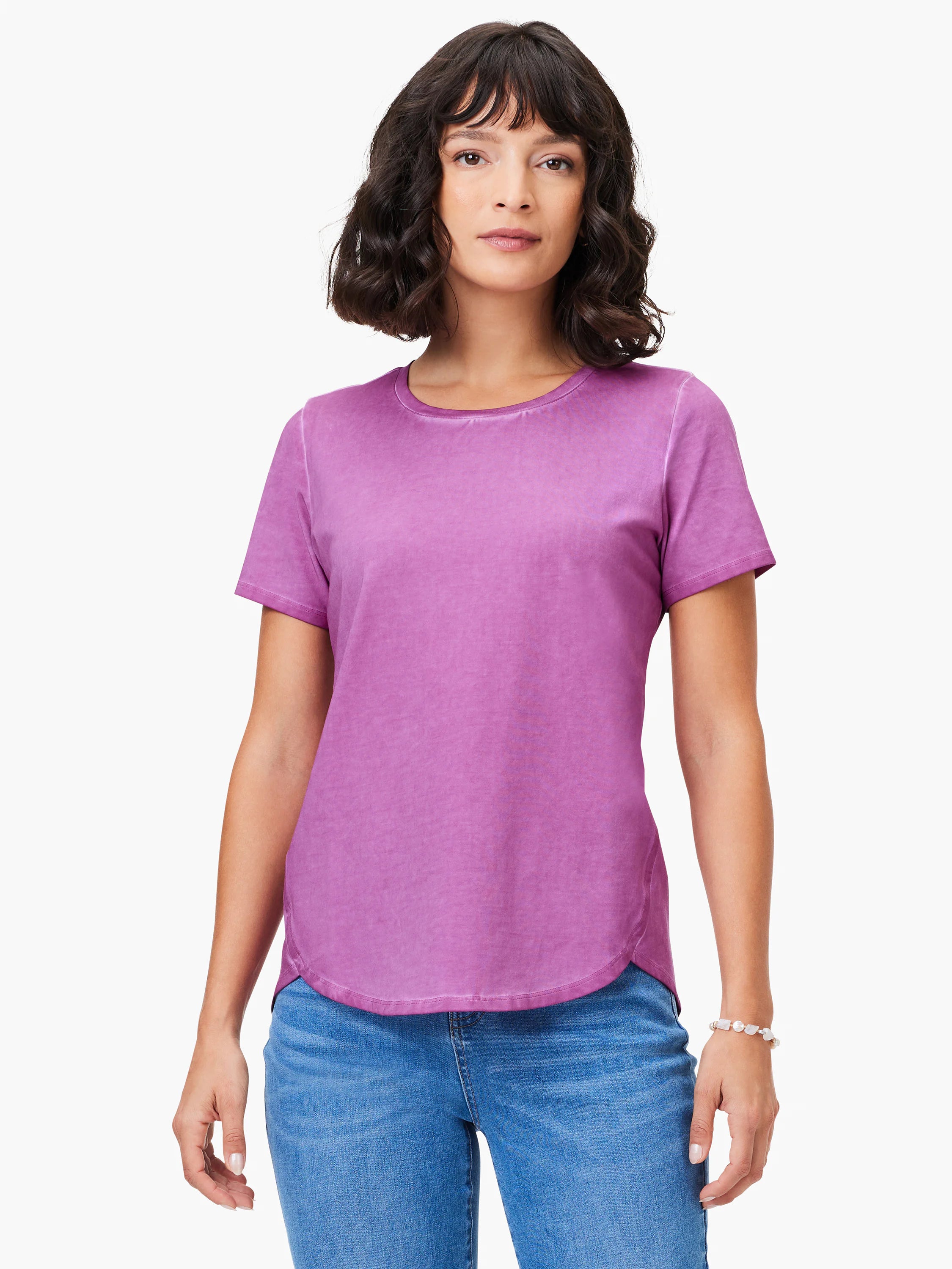 Purple short sleeve crew neck tee with a washed look and a shirt tail hem.