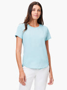 Light blue short sleeve crew neck tee with a curved shirt tail hem.