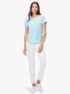 Light blue short sleeve crew neck tee with a curved shirt-tail hem.