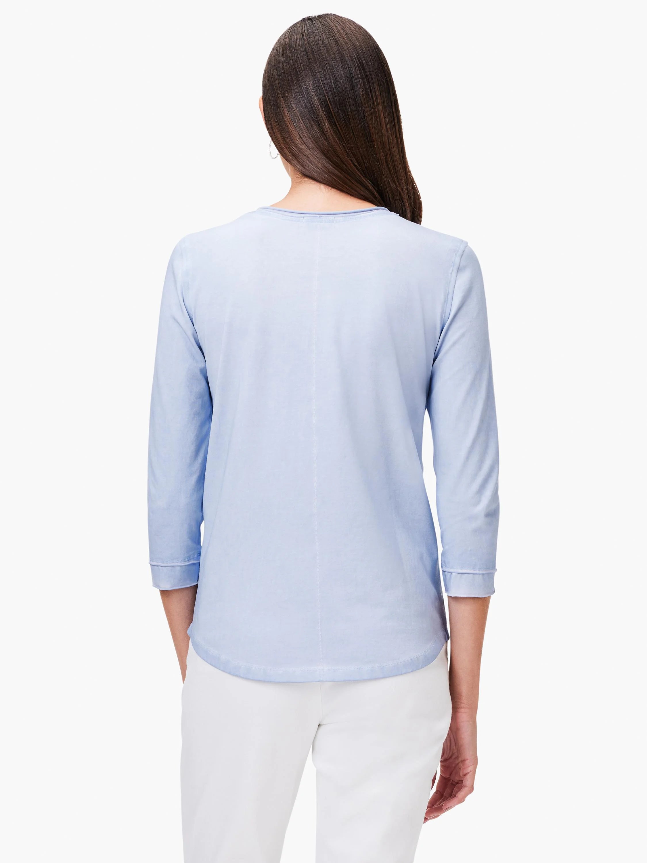 Light blue 3/4 sleeve tee, back view. Rolled cuffs and a central vertical back seam.