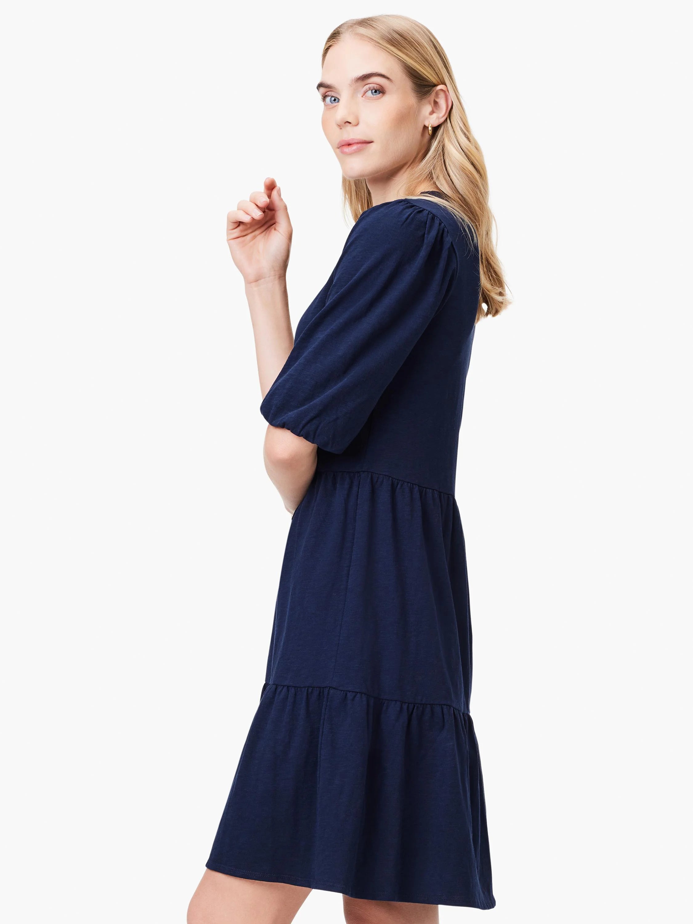 Navy blue tiered mini dress with elbow-length puffed sleeves and V-neck.