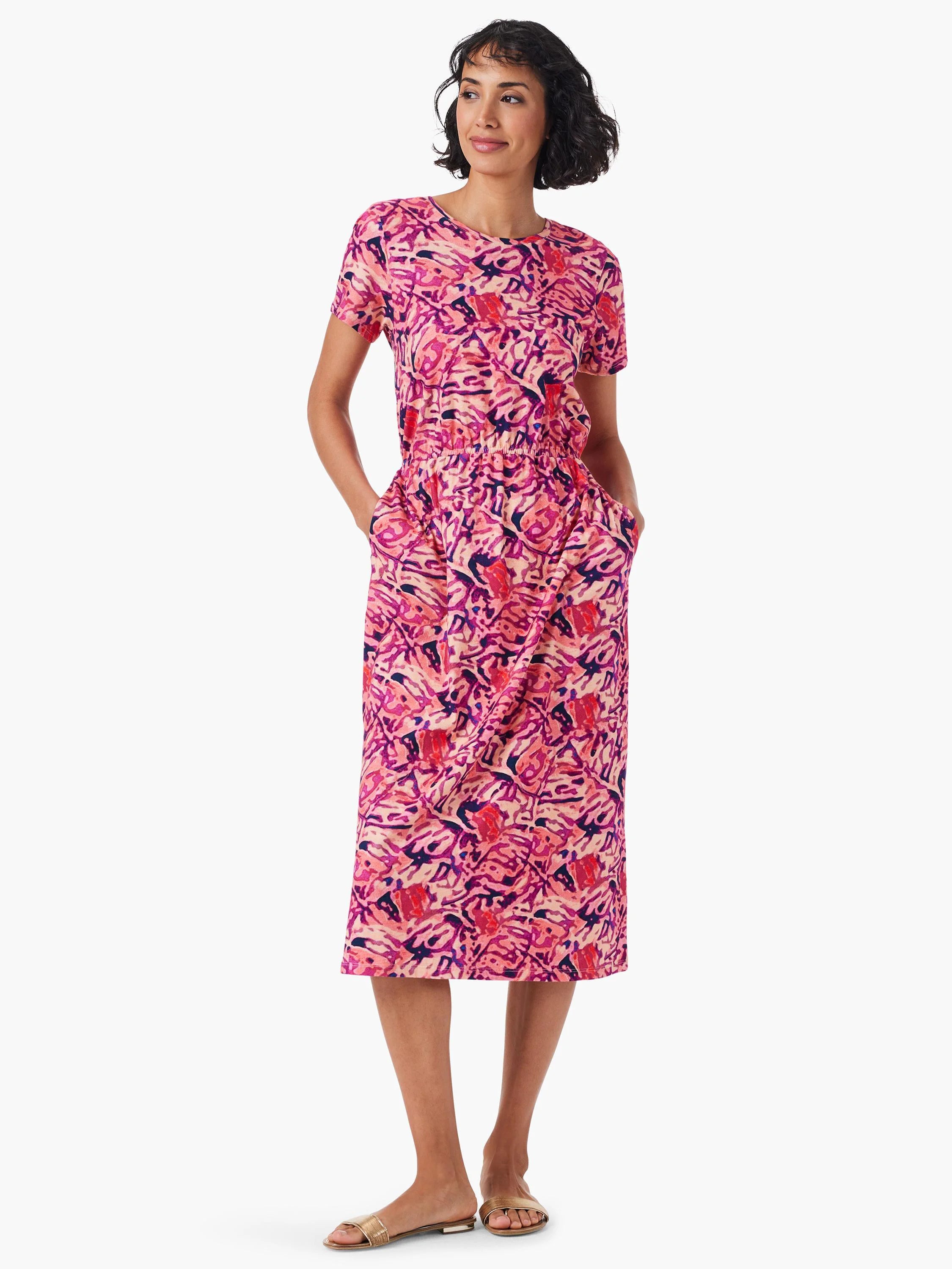 Pink midi dress with short sleeves, pockets, and an abstract pink, purple, and orange print.  Elastic waistband.