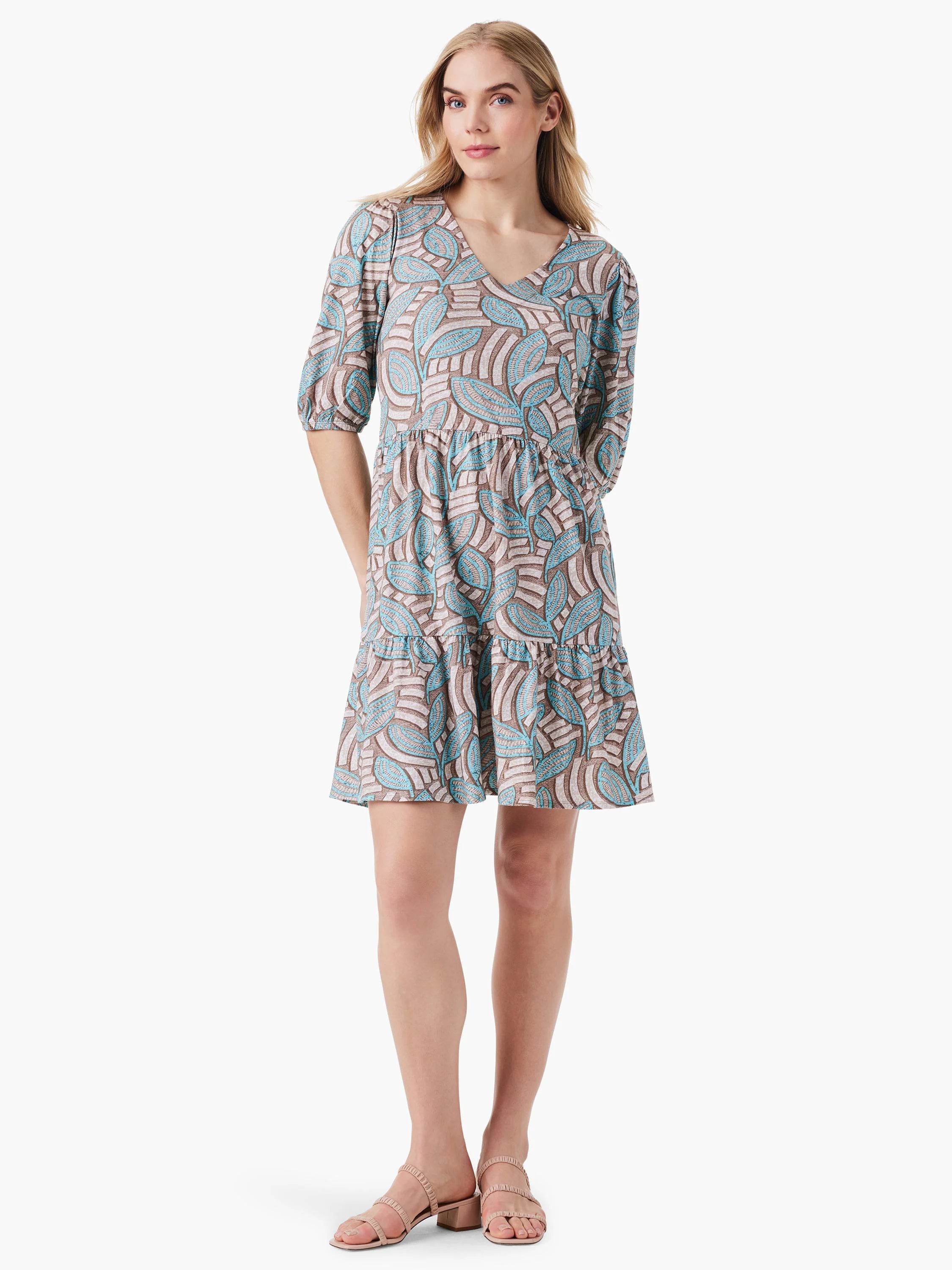 Teal and brown leaf patterned mini dress; V-neck, elbow sleeves, tiered skirt.
