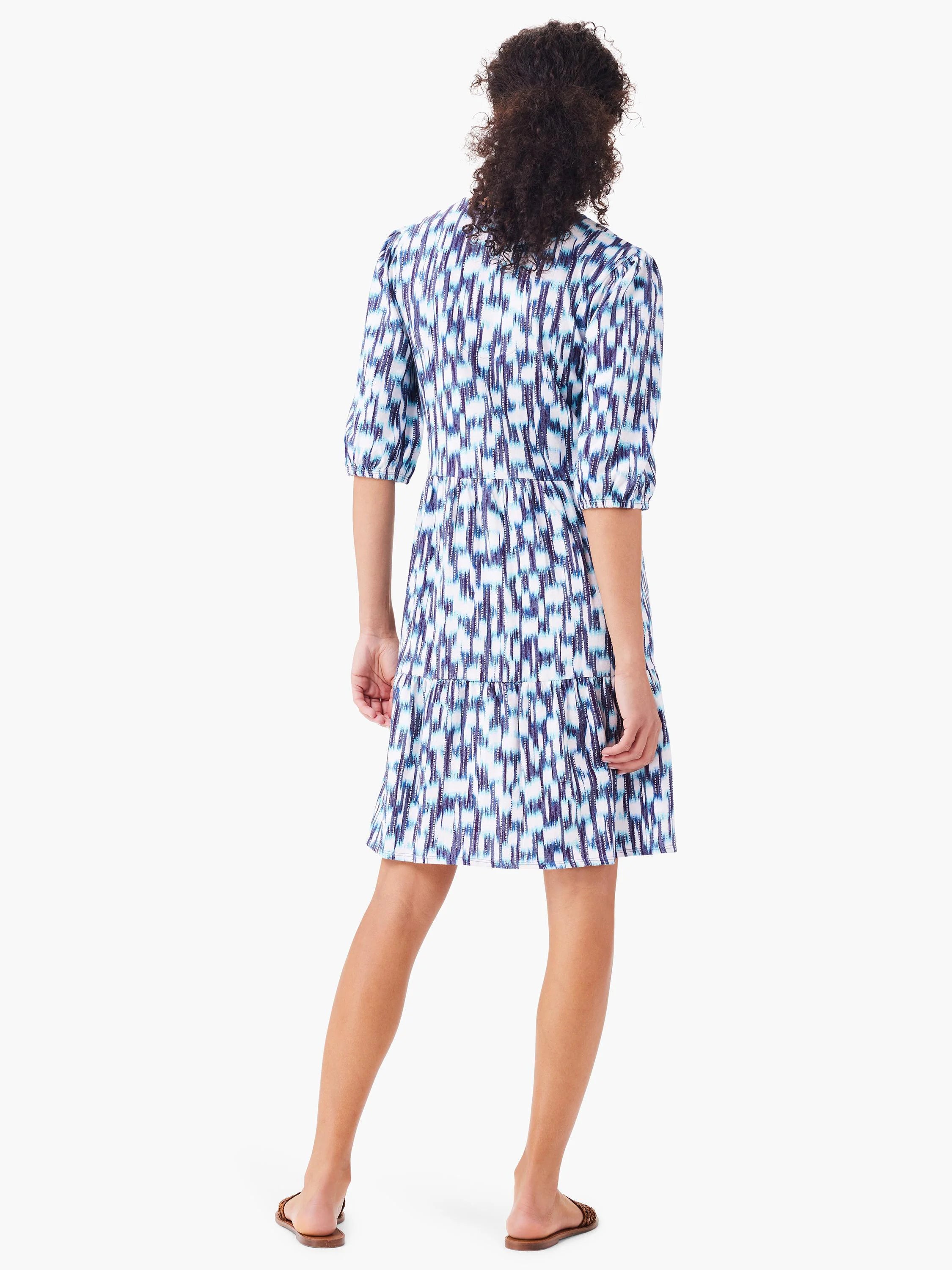 White dress with blue and purple ikat pattern.  Three-quarter sleeves, V-neck.  Tiered skirt.
