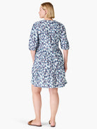 Here's alt text for the image, suitable for visually impaired users:

"Back view of a tiered, V-neck, elbow-sleeve dress....