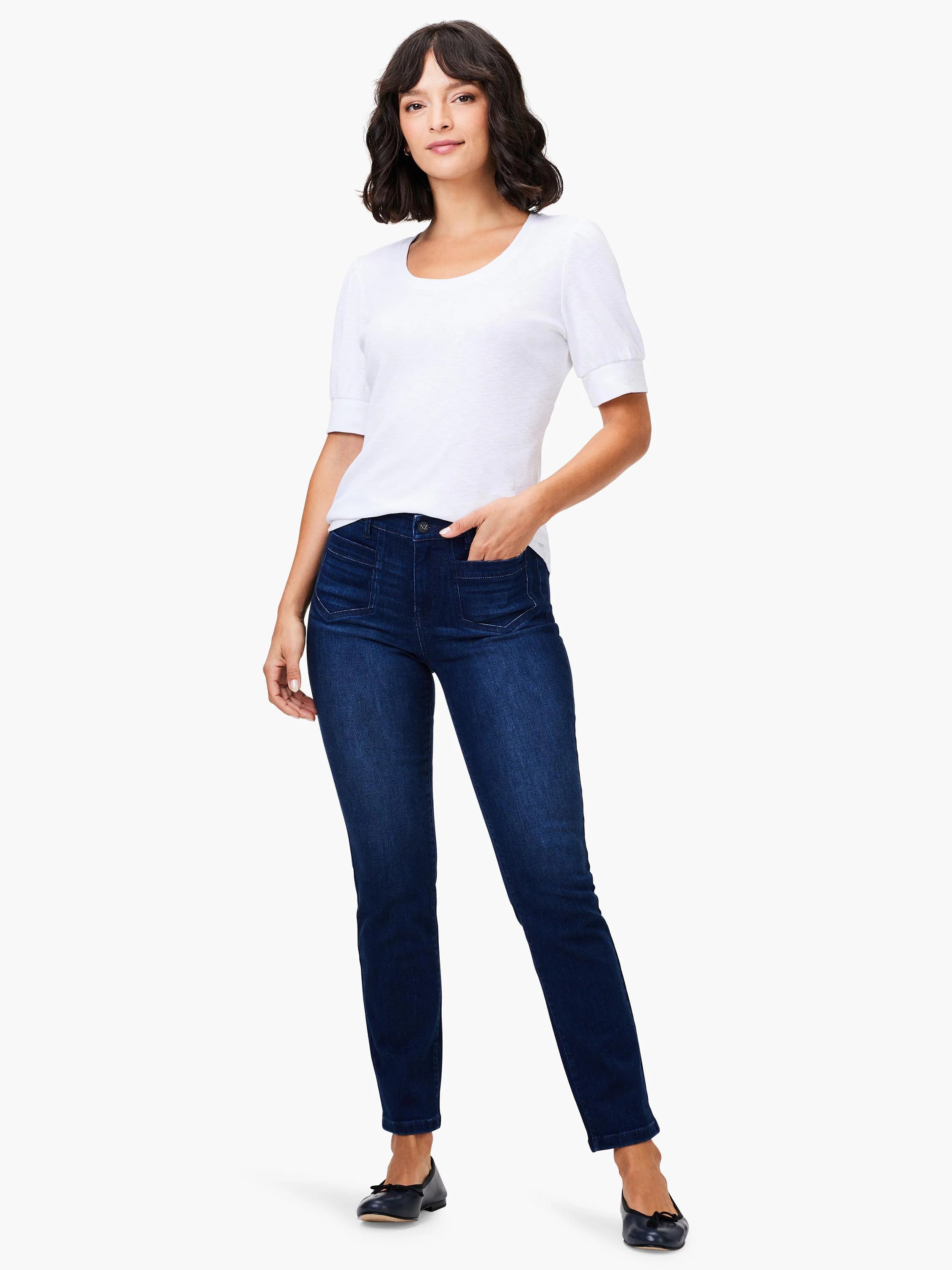 White scoop-neck, short-sleeve tee; dark wash jeans; model shown for scale.
