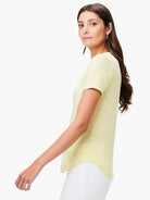 Pale yellow short sleeve V-neck tee with a subtle slub texture and curved hem.
