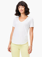 White short sleeve V-neck tee. Features a subtle texture, relaxed fit, and curved hem.