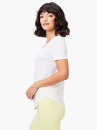White short sleeve V-neck tee with a subtle slub knit texture.