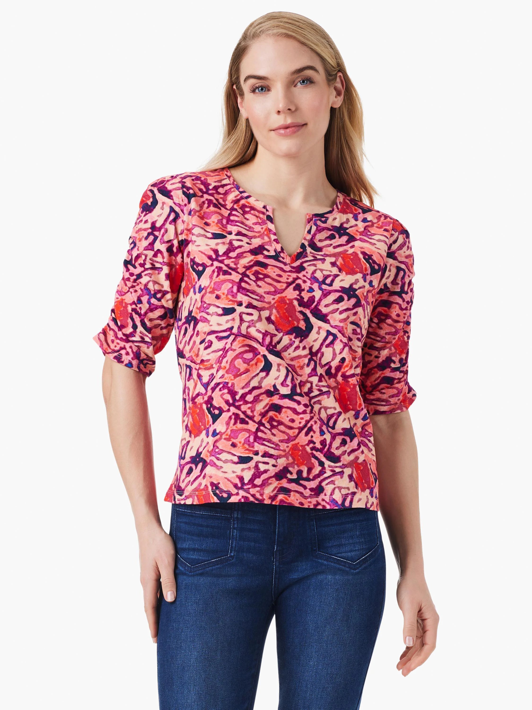 Pink, red, and purple abstract print top.  Three-quarter sleeves, ruched detail, V-neck.