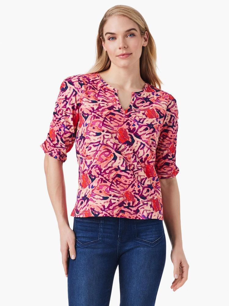 Pink, red, and purple abstract print top.  Three-quarter sleeves, ruched detail, V-neck.