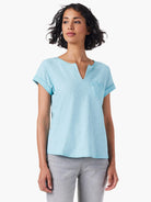 Light blue short-sleeved tee with split neckline and small chest pocket.