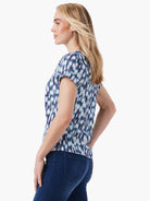 Short-sleeved, split-neck tee with a teal, white, and dark-blue abstract print.