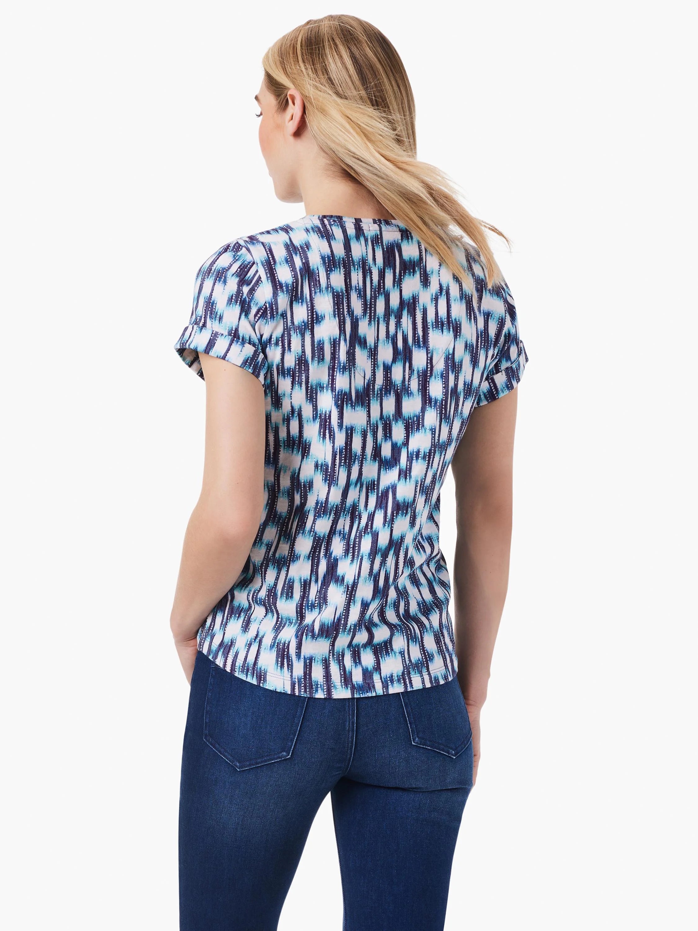 Image of short-sleeved split-neck tee.  Teal, blue, and white abstract print on a white background.  Short sleeves with...