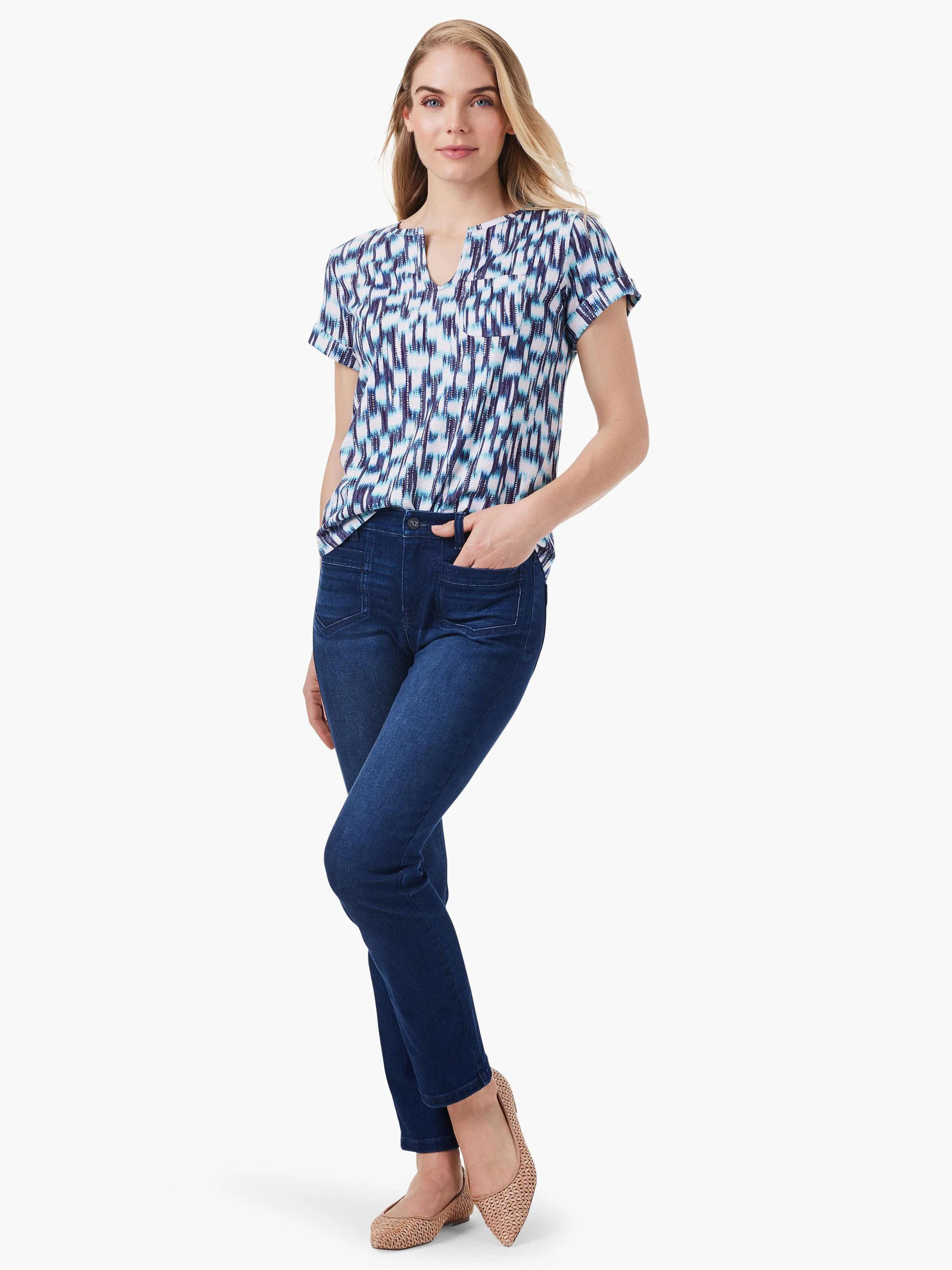 Short-sleeved split-neck top with blue, teal, and white abstract print.