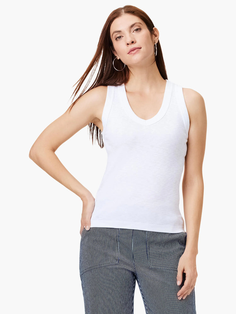 White V-neck sleeveless shirt.  Close-fitting, simple style.