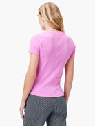 Pink short-sleeved scoop neck t-shirt.  Back view shows textured fabric.