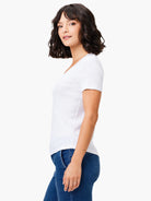 White scoop-neck short-sleeve tee shown on model.