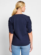 Here's alt text that describes the image concisely and accessibly:

Dark navy blue, elbow-sleeve t-shirt.  Ruched...