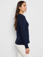 Navy blue, long-sleeve henley shirt with textured fabric and scalloped hem and cuffs.