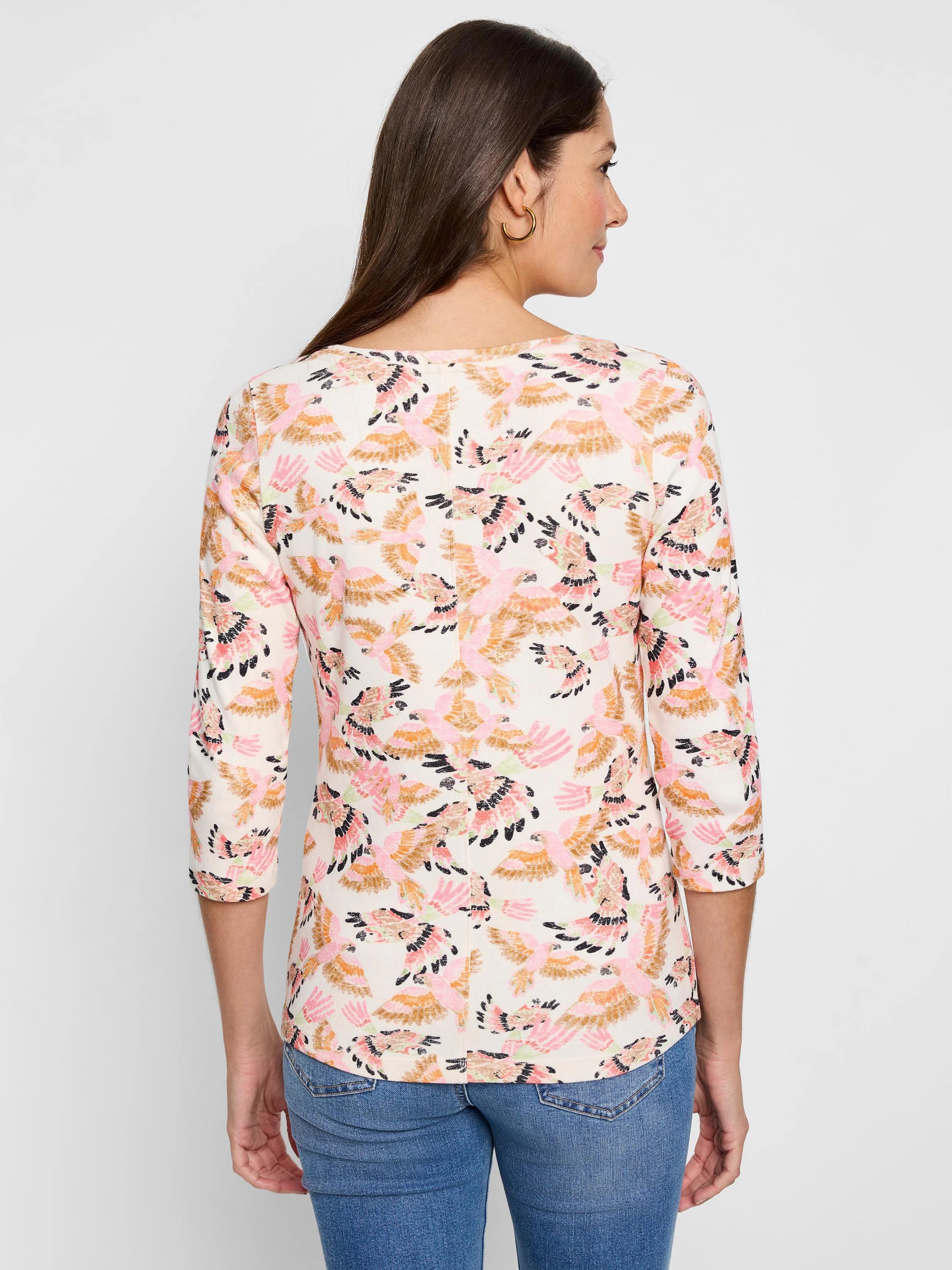 Off-white 3/4 sleeve shirt.  Pink, orange, & brown bird print.  Boat neck.