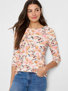 Off-white 3/4 sleeve boatneck shirt. Pink, orange, brown bird print.