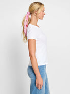 White short sleeve crew neck tee. Lightweight fabric with a subtle texture.