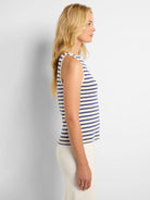 Off-white sleeveless tank top with navy blue horizontal stripes.