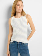 Off-white sleeveless tank top with thin, light blue horizontal stripes.  Round neckline.