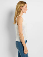 Off-white sleeveless tank top with thin, light blue horizontal stripes.