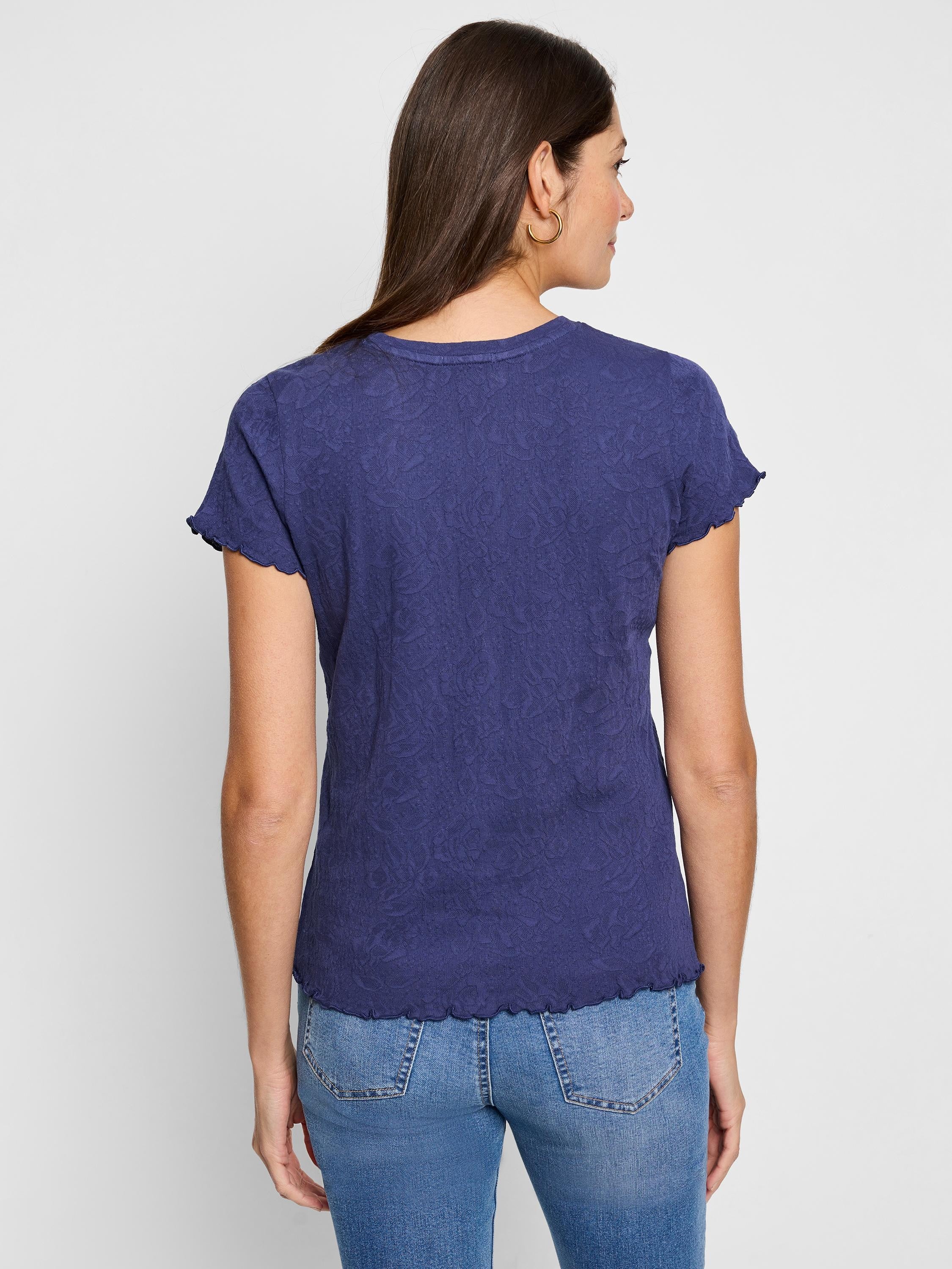 Dark blue, short-sleeved knit t-shirt.  Textured fabric, scalloped hem and sleeves.