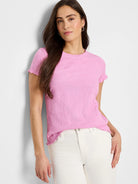 Pink textured knit t-shirt with short sleeves and scalloped hem.