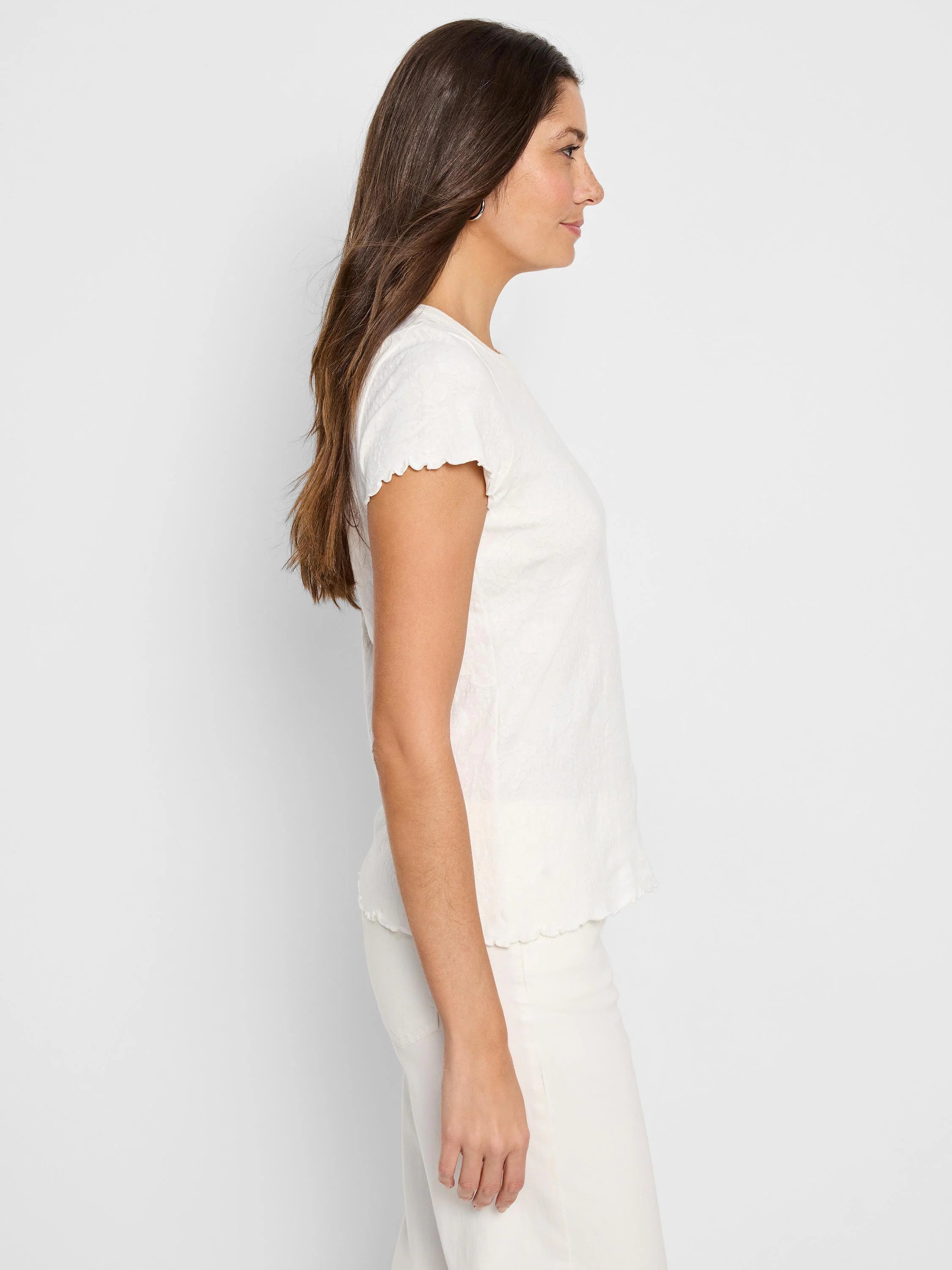 Off-white lace-knit t-shirt; short sleeves with scalloped edges;  textured fabric.