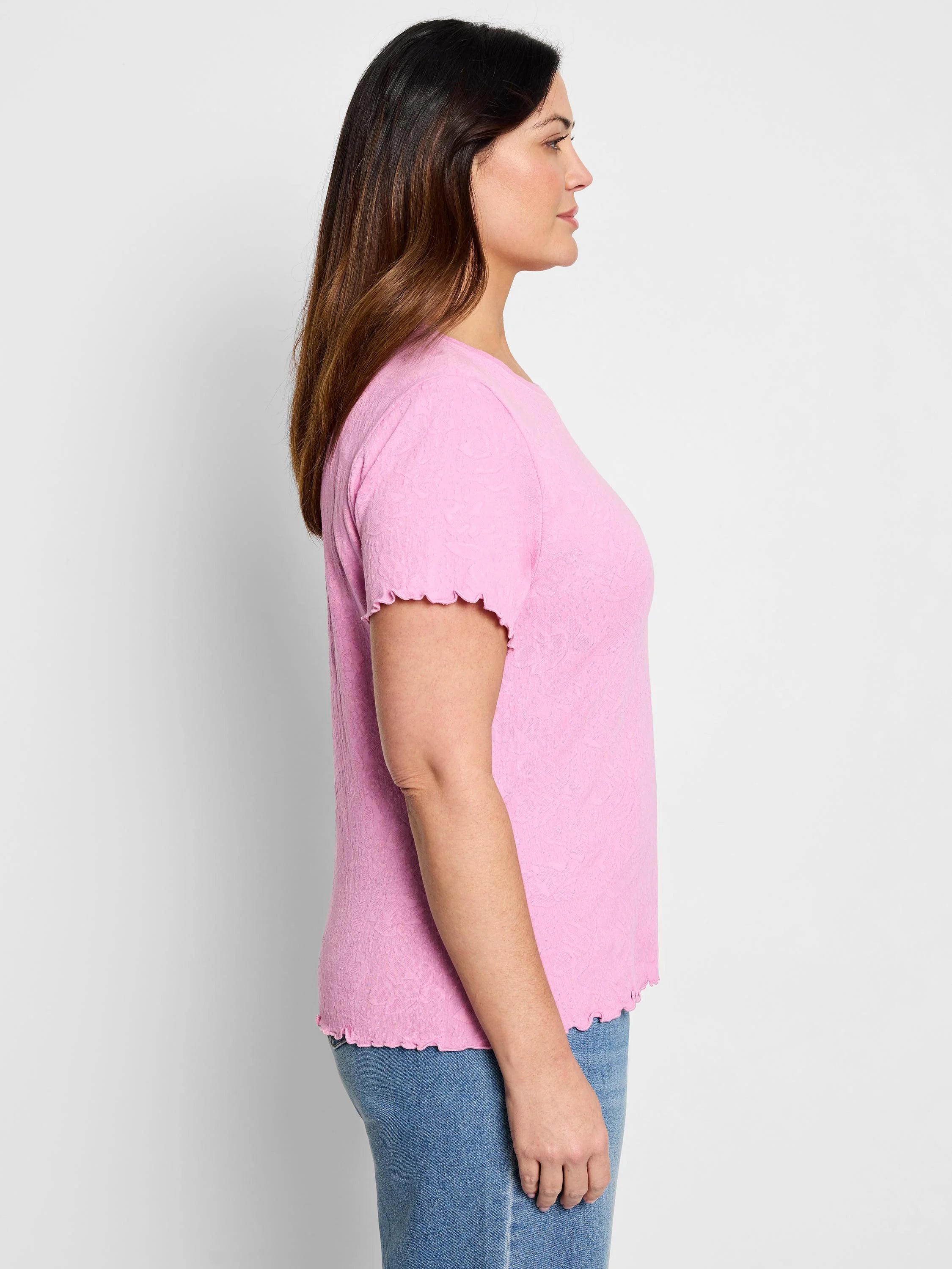 Pink knit t-shirt with short sleeves and scalloped edges.  Textured fabric.