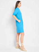Bright blue Henley dress, short sleeves, knee-length, side pockets.