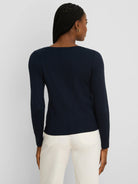 Dark blue ribbed long-sleeve boat neck tee with a center back seam, shown on a model from behind.