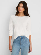 Light cream ribbed boat neck tee with 3/4 sleeves.