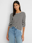 Black and white horizontally striped long-sleeve boat neck tee with ribbed texture.