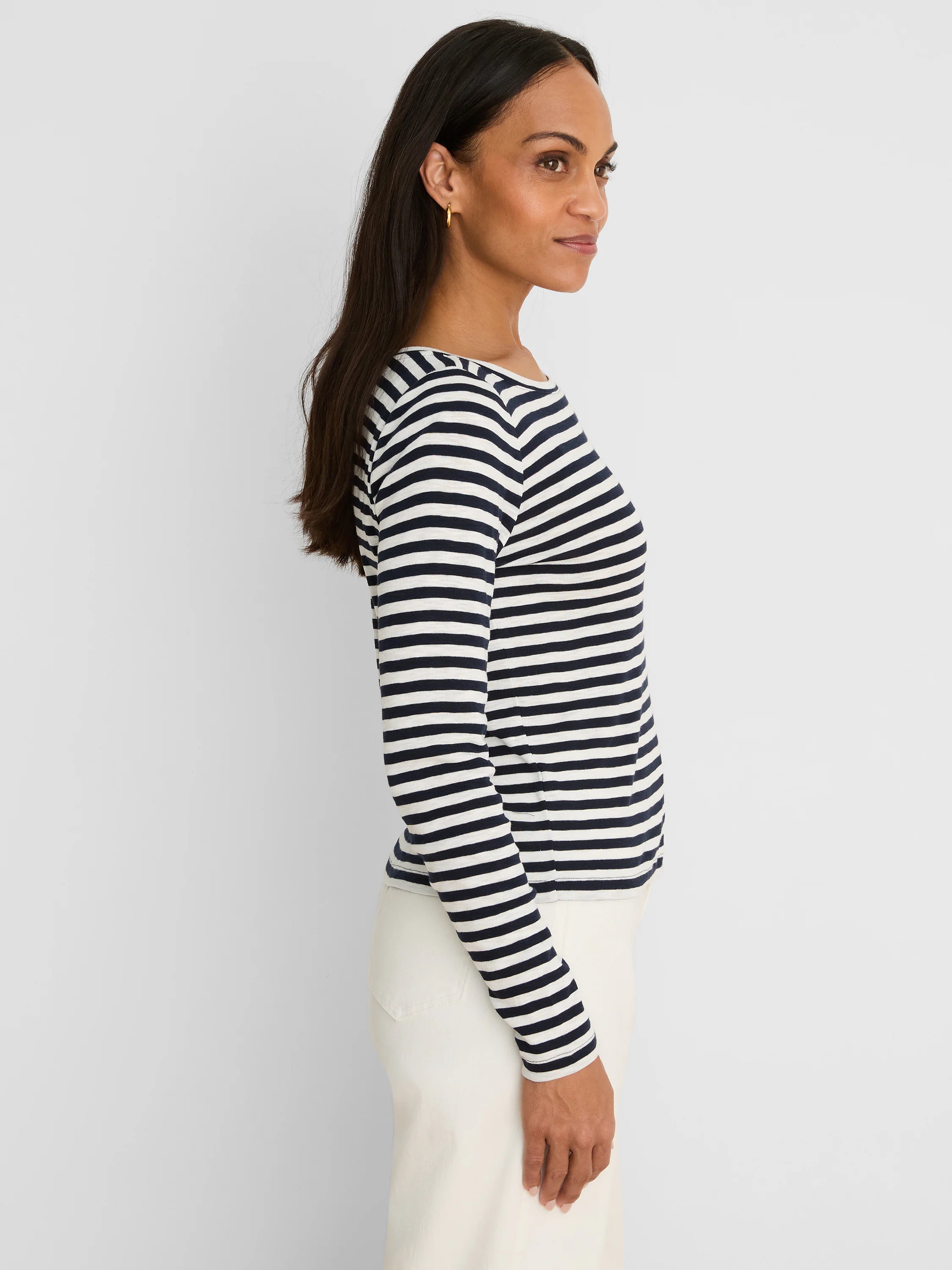 White and navy horizontal striped long-sleeve boat neck tee.