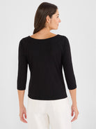 Casual black three-quarter sleeve top features a wide boat neck and a subtle slub knit texture.