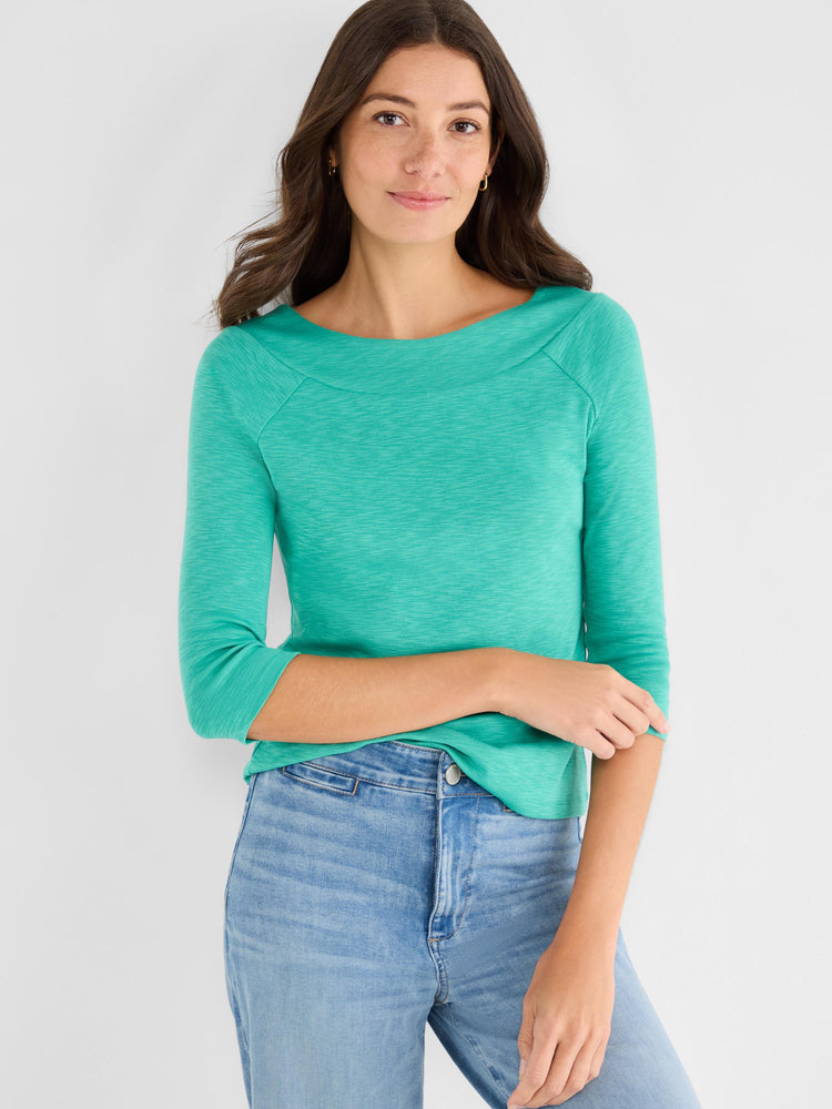 Fitted heathered teal knit top with raglan three-quarter sleeves and a wide boat neckline.