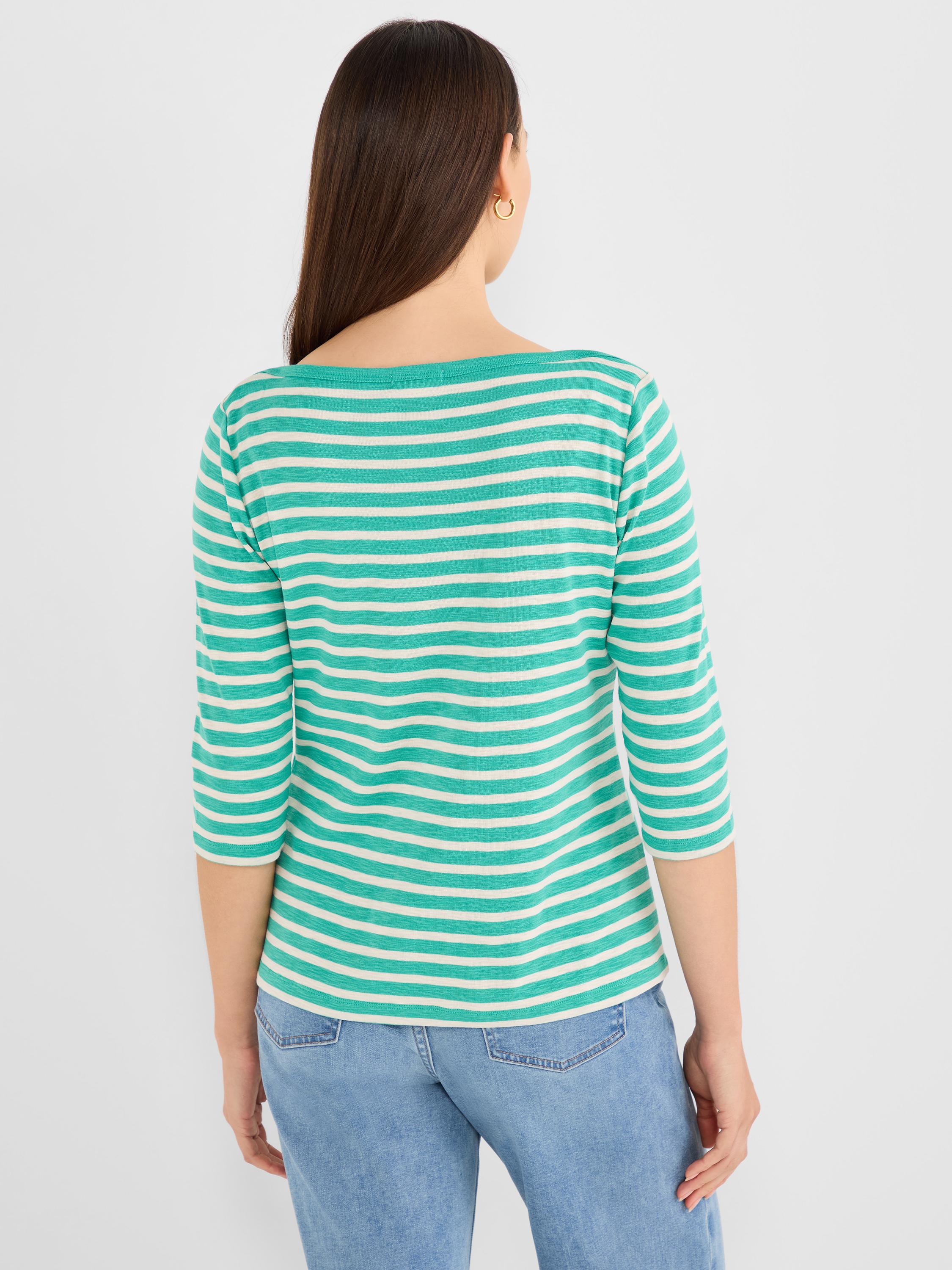 Green and cream striped knit top with a boat neckline and three-quarter sleeves.