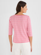 This regular-fit knit top is pink and white striped with a wide boat neck and 3/4 sleeves.