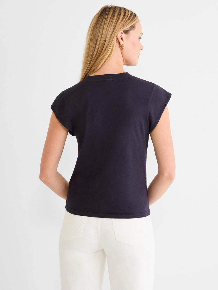 Navy cap sleeve tee, back view on model. Features a round neckline.