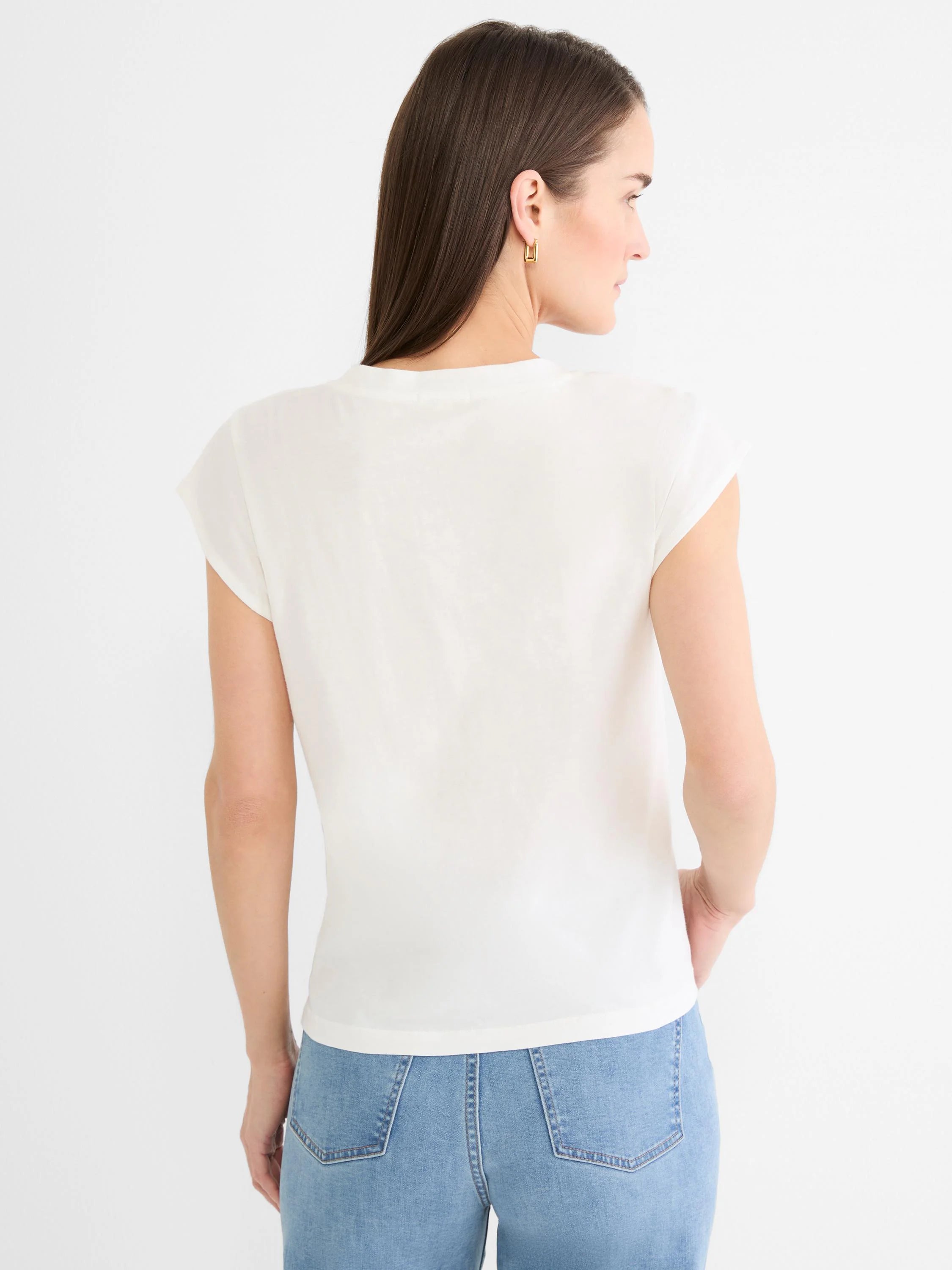 Back view of an off-white cap sleeve tee. Features a simple rounded back neckline and soft fabric.