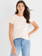 A fitted cream speckled short-sleeve ribbed knit t-shirt features a crew neck.