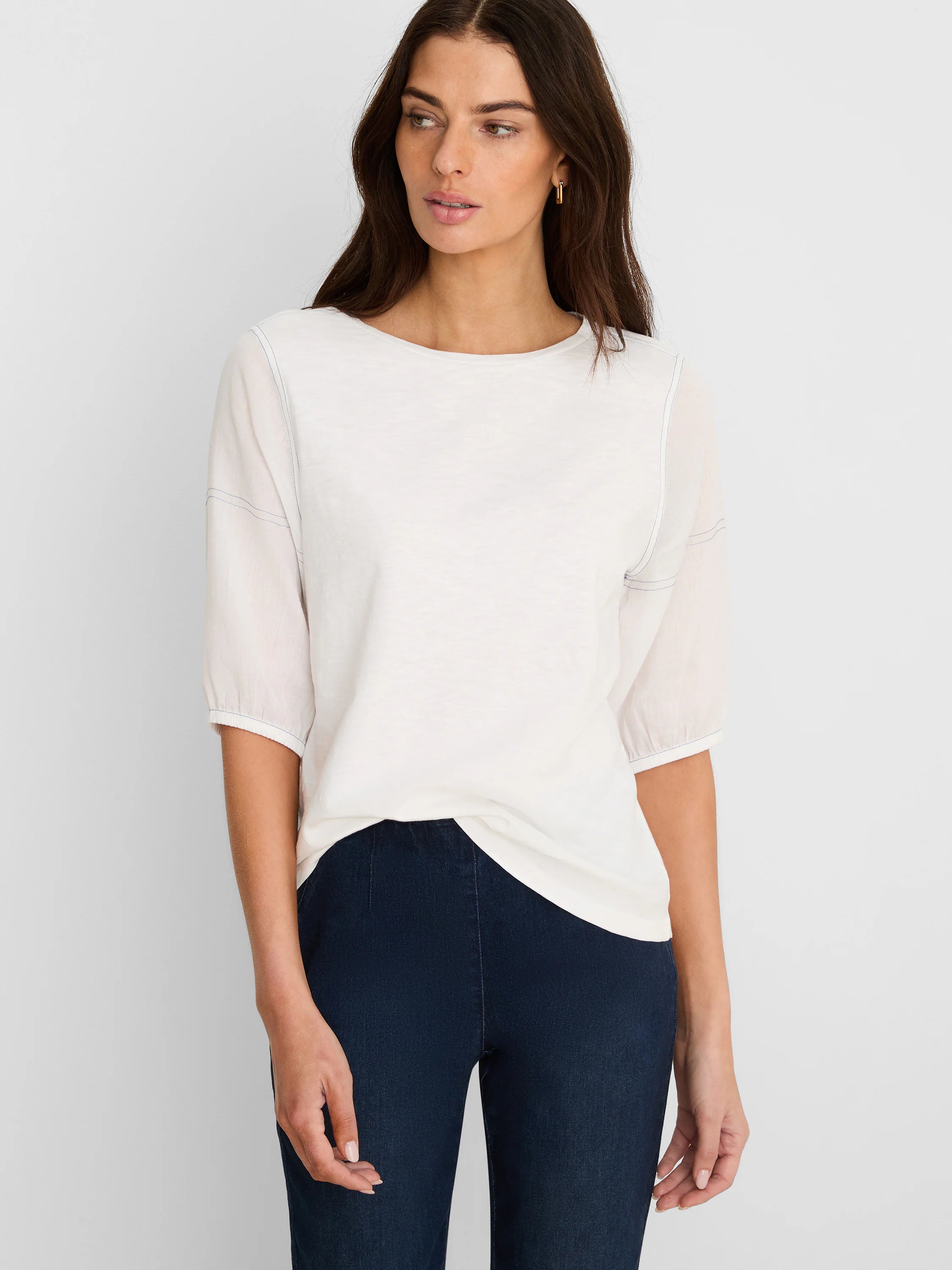 Off-white cotton tee with sheer 3/4 linen sleeves, visible blue stitching, and a boat neck.