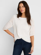 Off-white cotton tee with elbow-length linen sleeves, blue contrast stitching on seams & cuffs, and a round neck.