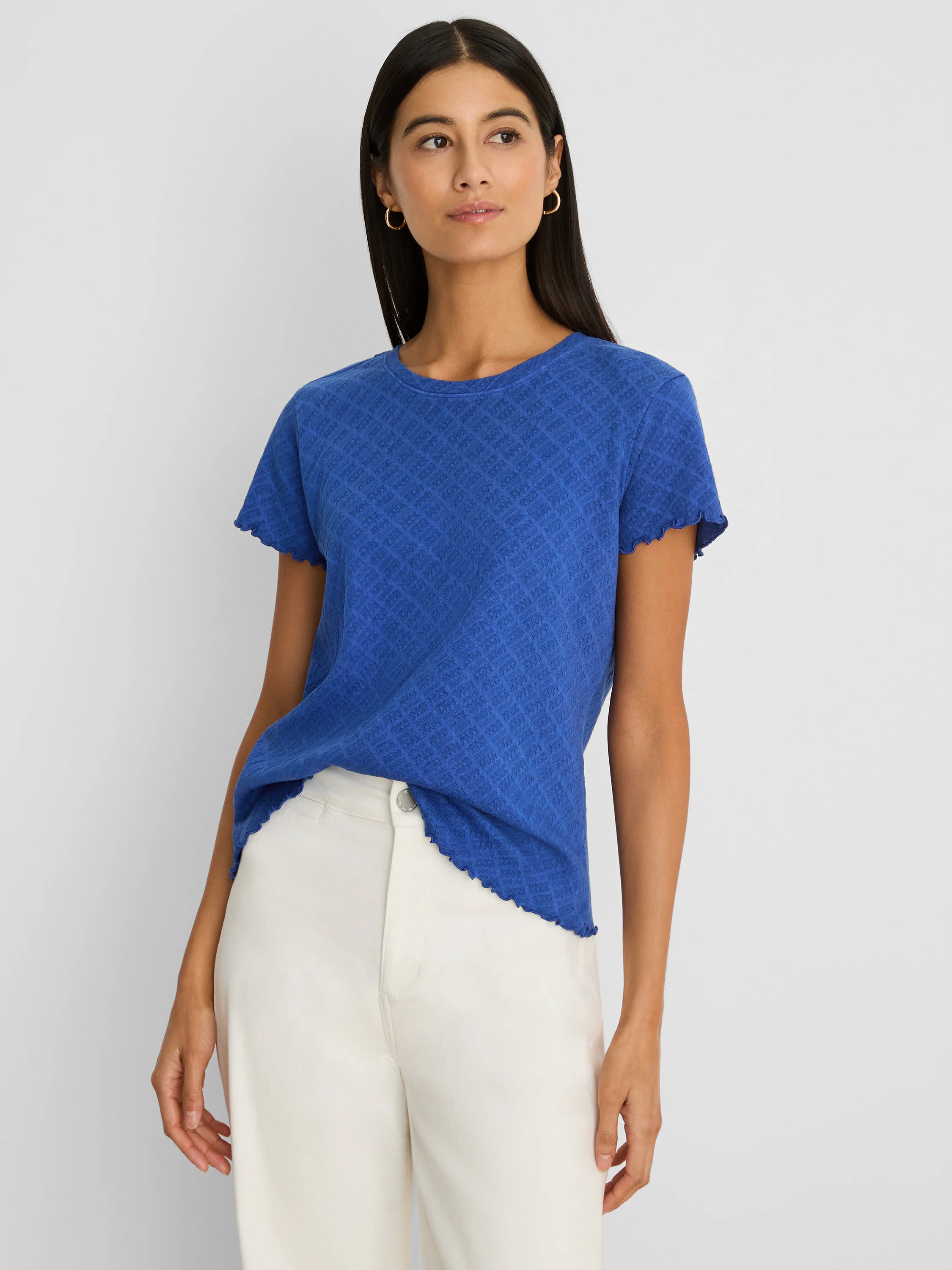 Royal blue lace knit t-shirt with a geometric pattern, round neck, and scalloped short sleeves and hem.